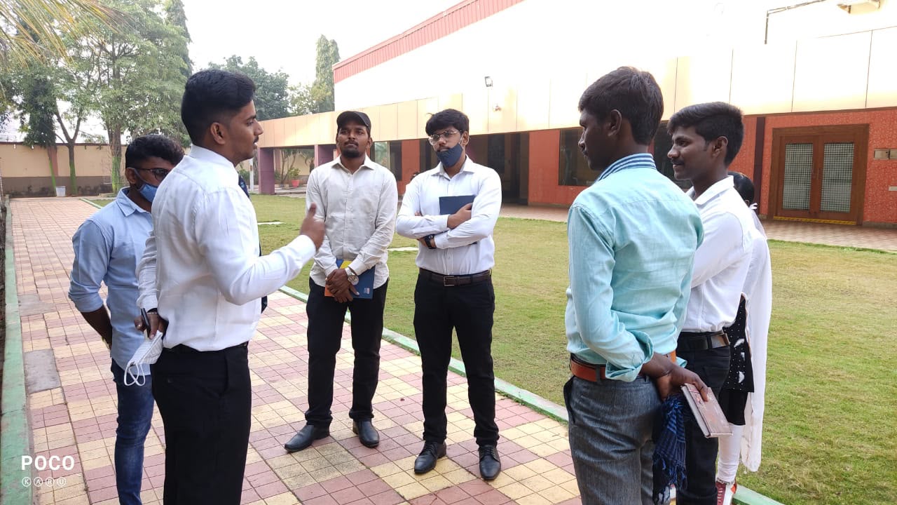 Coach Sreenivas Paturi meeting and coaching students outside